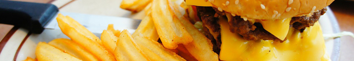 Eating Barbeque Burger at Chuckwagon BBQ & Burgers restaurant in Katy, TX.